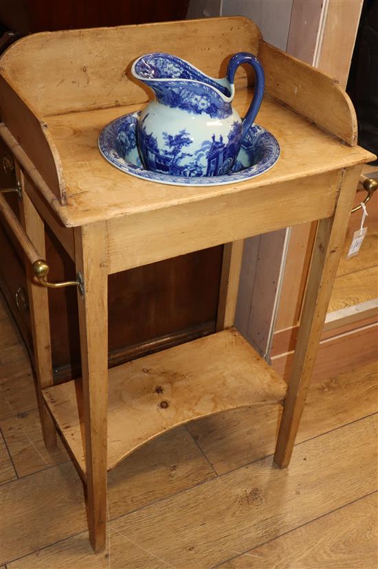 A Victorian pine washstand with later blue and white jug and basin W.62cm